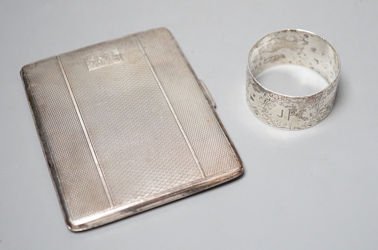 A silver cigarette case and a silver napkin ring.